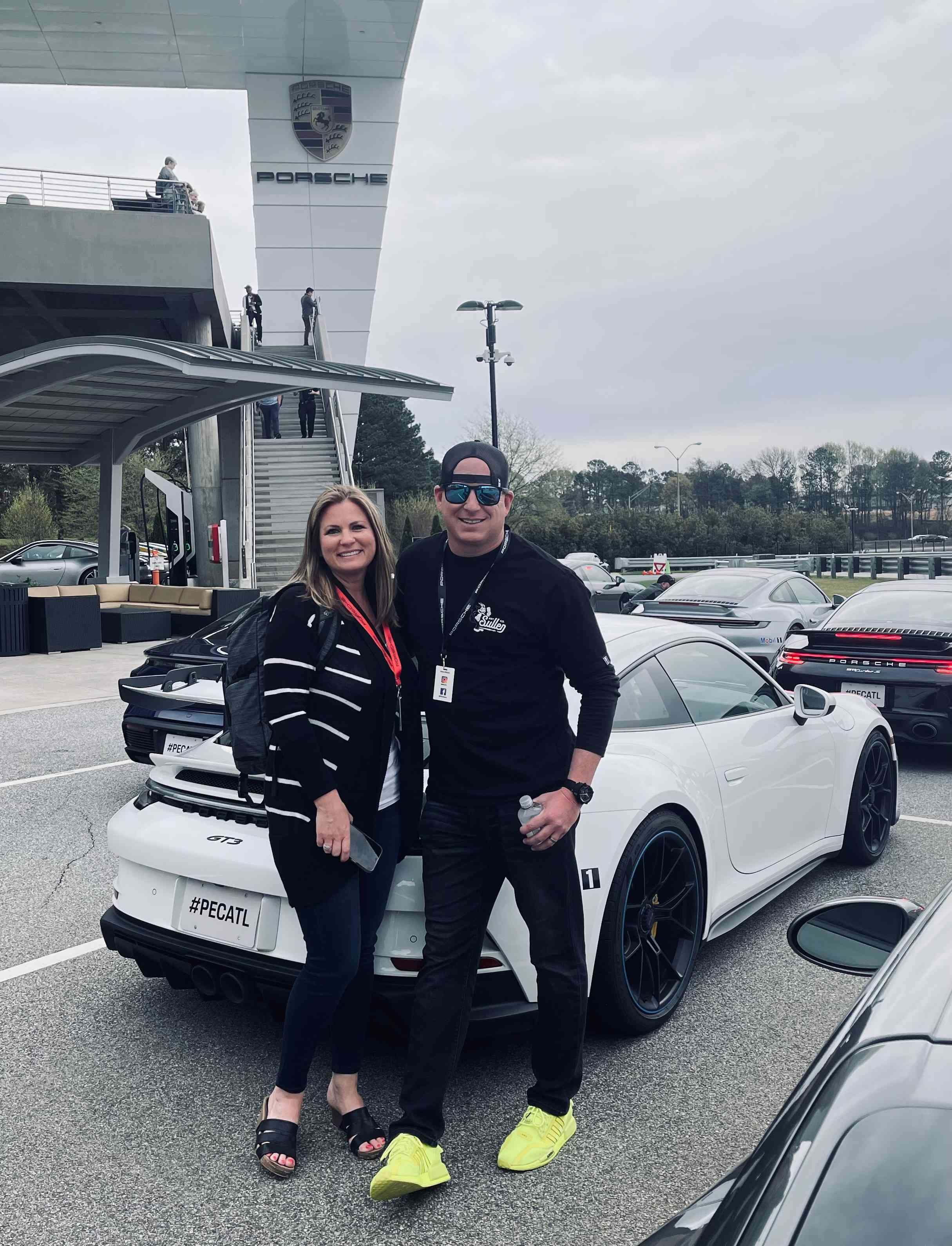 Barry Hargett with his wife at Porsche Office